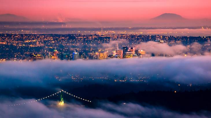 Foggy city from above at sunset, BC, Canada
