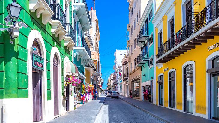 A street lined with colorful buildings on both sides
