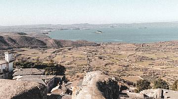 2 Day Montefiascone Itinerary - View of homes, water, hills and land, Italy 2 Day Montefiascone Itinerary - View of homes, water, hills and land, Italy