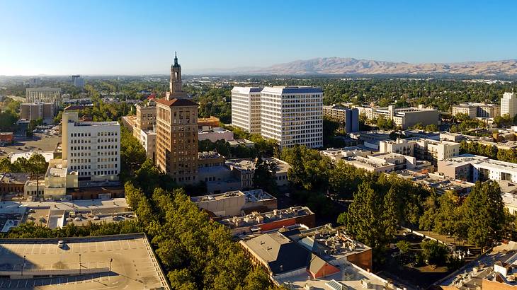 An aerial shot of city buildings on a sunny day