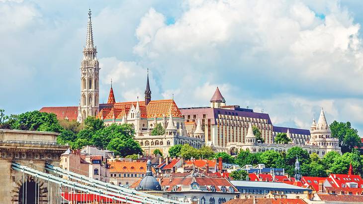 A skyline of old colorful castles and towers on a cloudy day