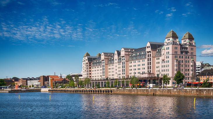 A large building with many windows near a body of water