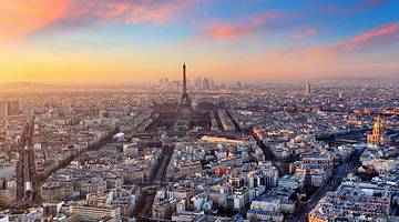 Aerial view of Paris with many famous landmarks in France, like the Eiffel Tower