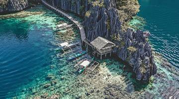 Aerial shot of the blue Twin Lagoon in Coron, one of the best Palawan tourist spots