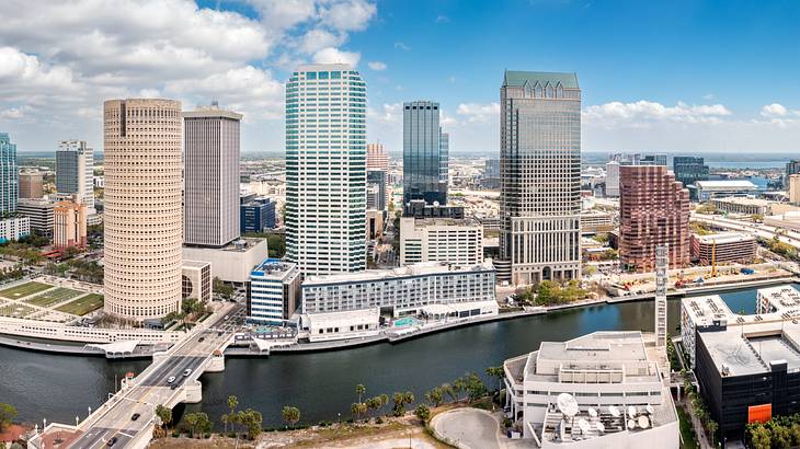 Aerial shot of a city with tall buildings on a cloudy day