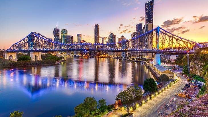 Best Brisbane Lookouts - Panorama of a colourful sky with buildings and a bridge