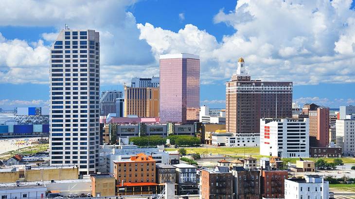 A city with skyscrapers and other buildings under a blue sky with clouds A city with skyscrapers and other buildings under a blue sky with clouds