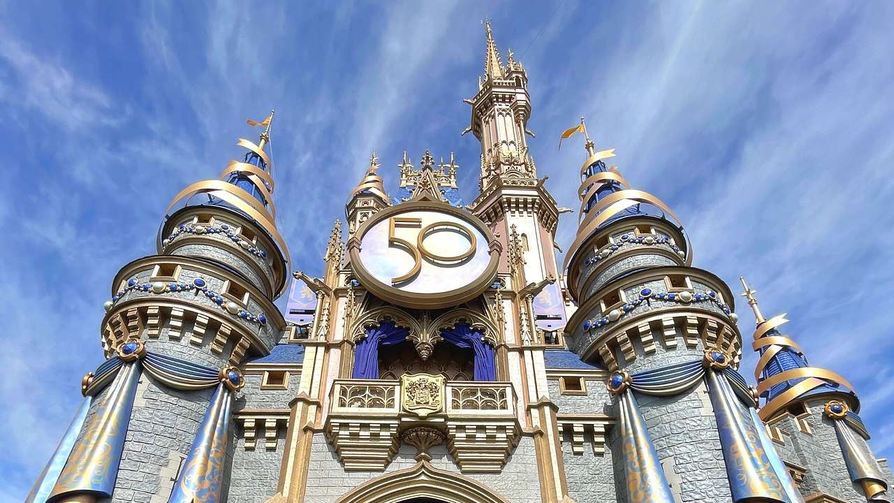 Looking up at a life-sized princess castle with a sign that says "50"