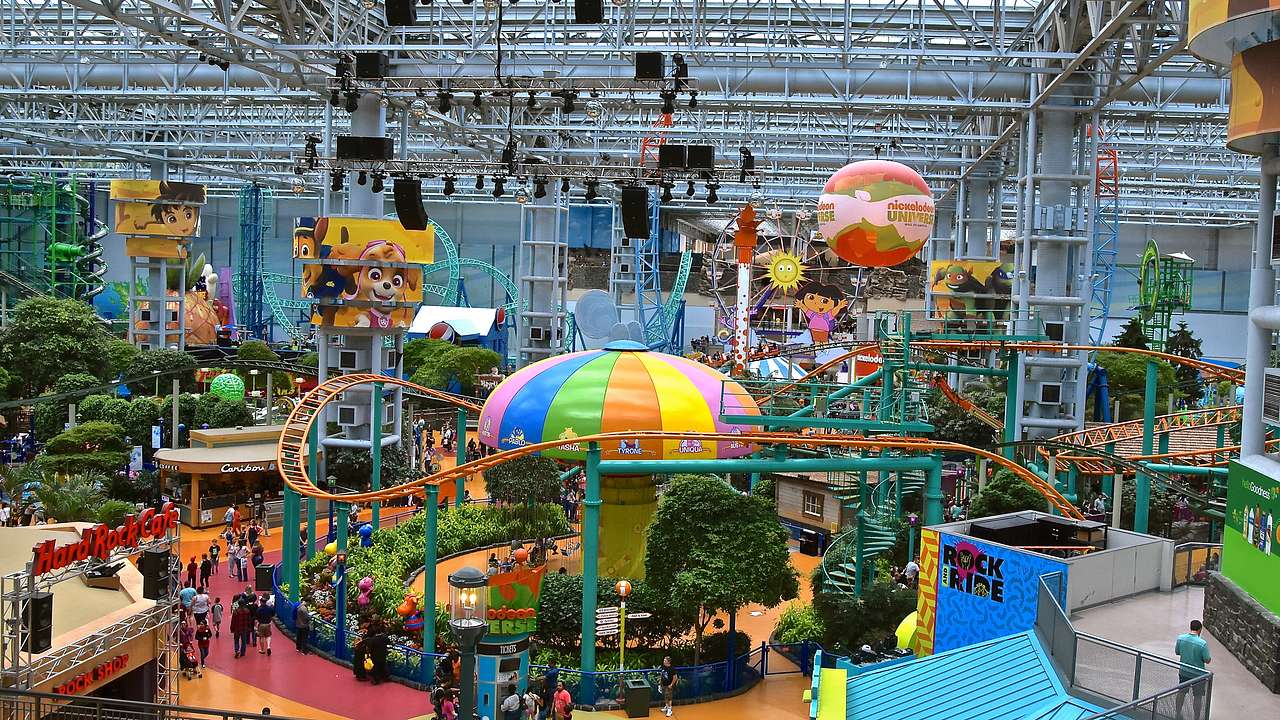 Looking at an indoor amusement park with colorful rides