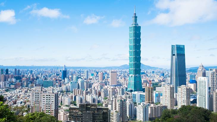 Panorama of Taipei city, full of buildings and skyscrapers, on a sunny morning