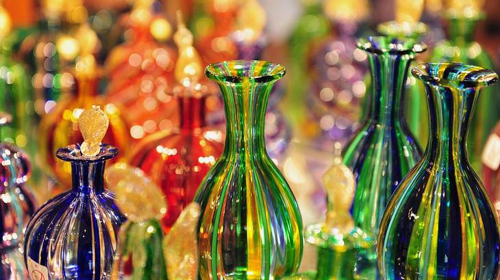 Up-close shot of shiny and colorful handmade glass bottles