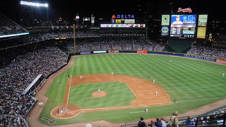 A baseball field at night with a game in play