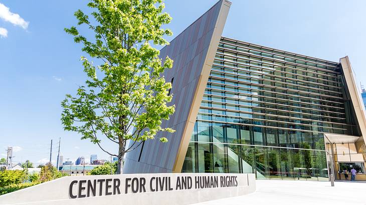 A modern building with a "National Center for Civil and Human Rights" sign A modern building with a "National Center for Civil and Human Rights" sign