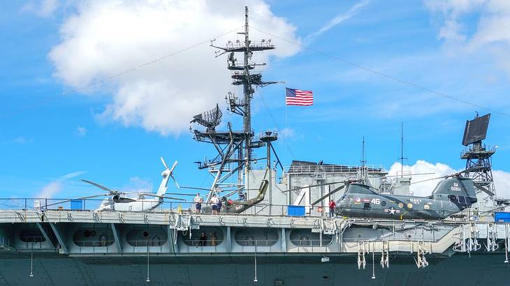A US Navy boat with an American flag on it