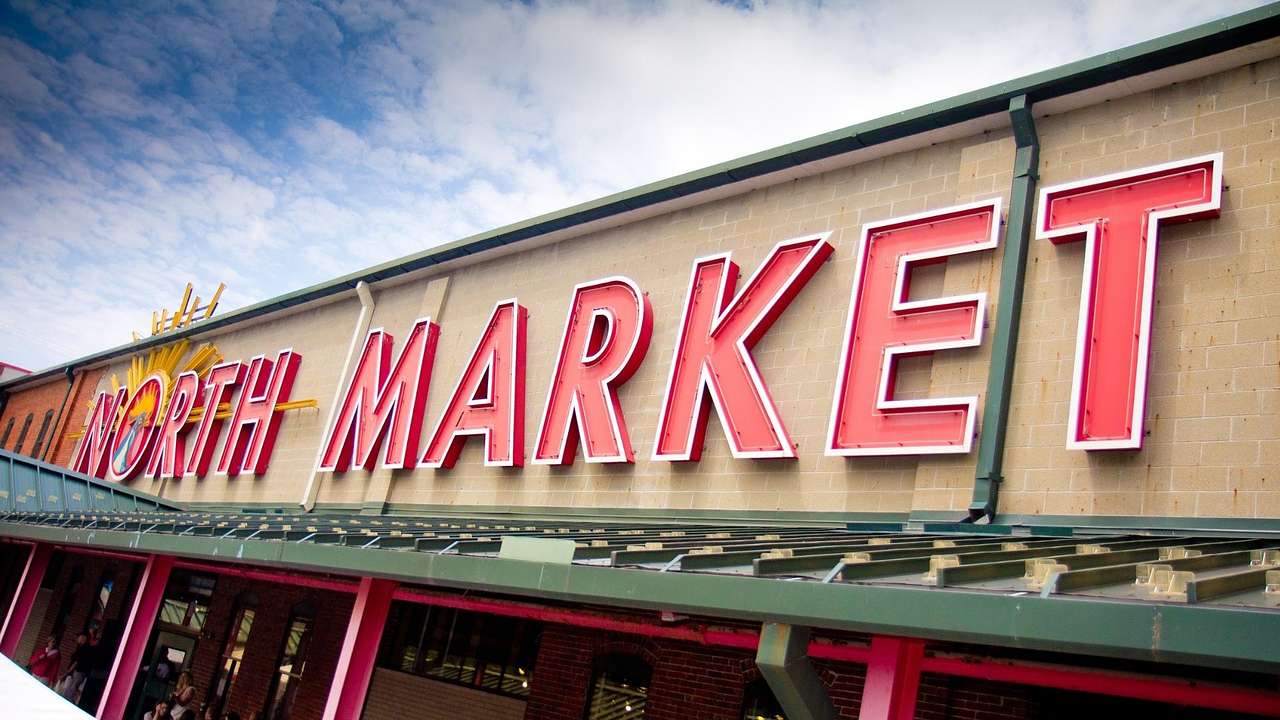 A building with a large red sign that says "North Market" on it