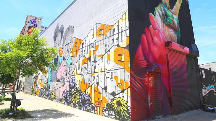A building with colorful murals on two of its walls A building with colorful murals on two of its walls