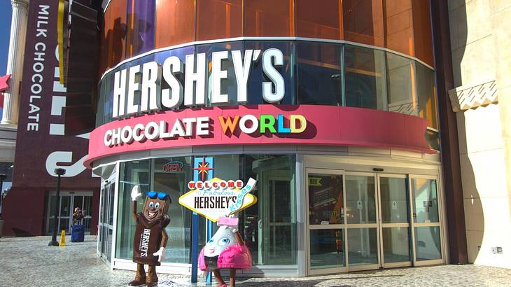 A Hershey's Chocolate World with two Hershey characters in front of it