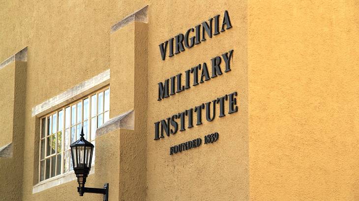 A yellow wall with a "Virginia Military Institute" sign on it A yellow wall with a "Virginia Military Institute" sign on it