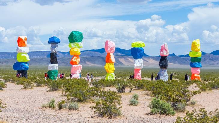 Seven towers made of colored boulders standing in the desert