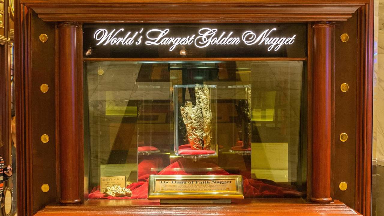 A display case with a golden nugget