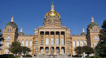 The impressive front facade of the Iowa State Capitol Building with a gold dome top