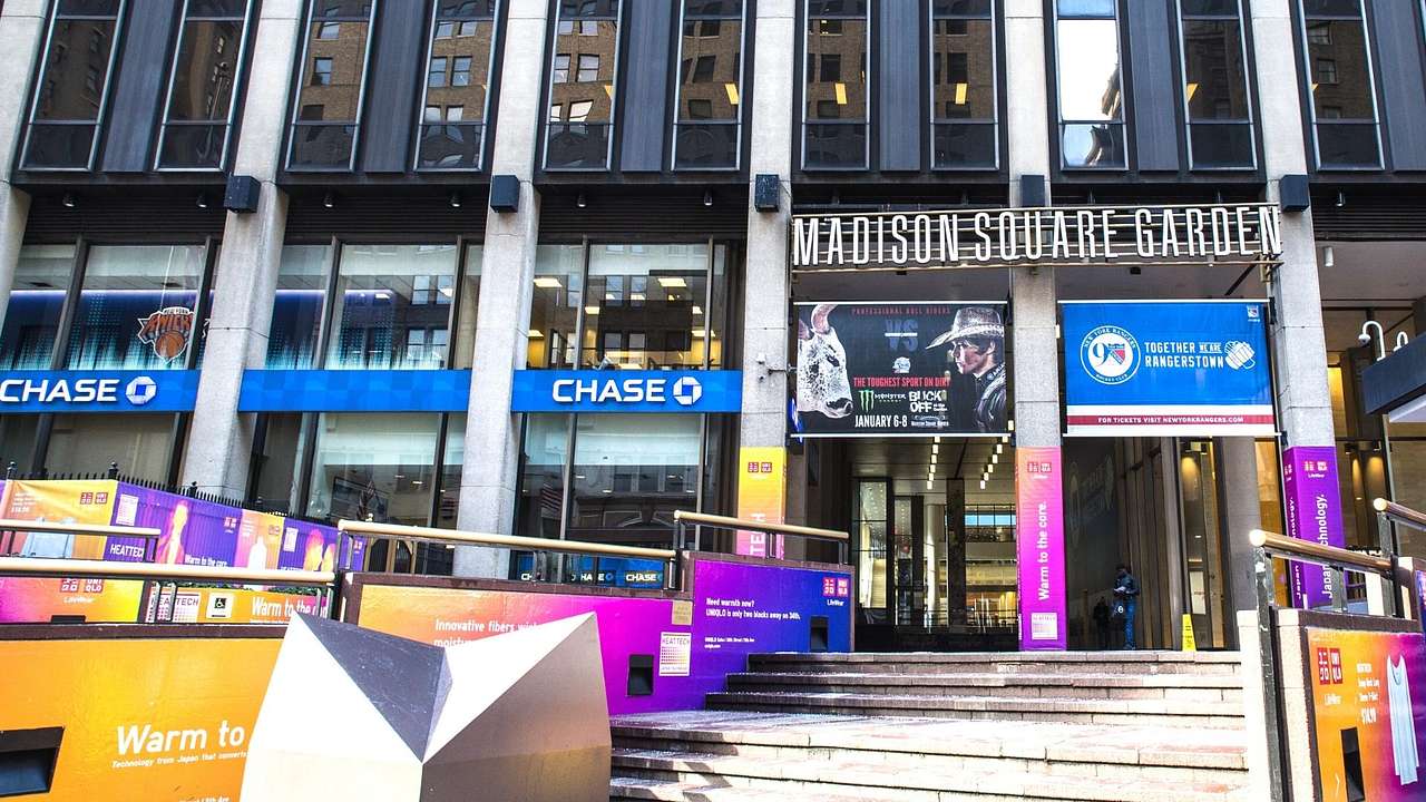 The entrance to Madison Square Garden with banners on the outside of the building