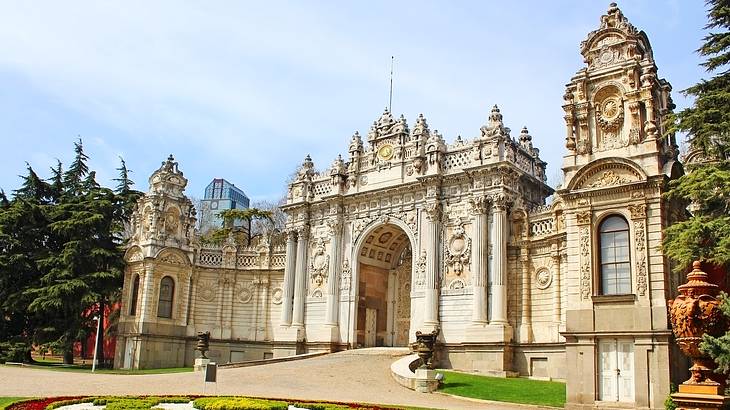 A historical building with gold and crystal decorations against a partly cloudy sky