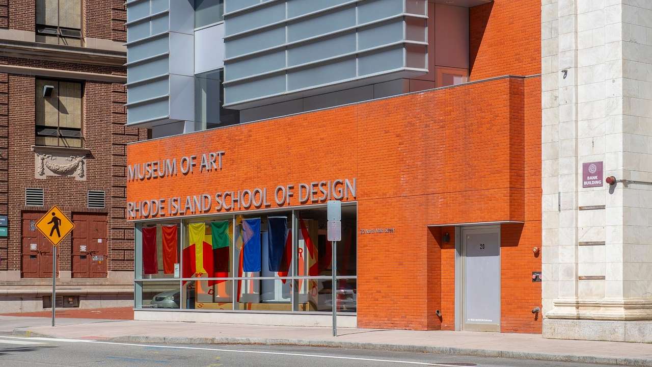 An orange building with a "Museum of Art Rhode Island School of Design" sign on it
