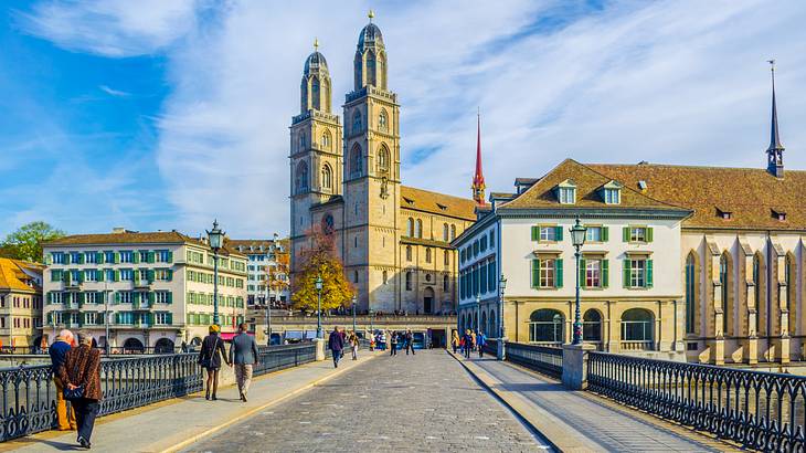 A footbridge leading to an old church and other old buildings