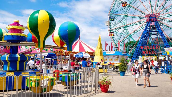 A colorful theme park with rides and a Ferris Wheel