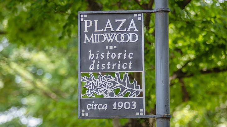 An iron sign that says "Plaza Midwood Historic District, Circa 1903" An iron sign that says "Plaza Midwood Historic District, Circa 1903"