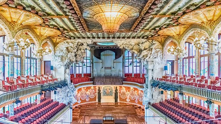 The interior of an intricate concert hall lit up with natural lighting