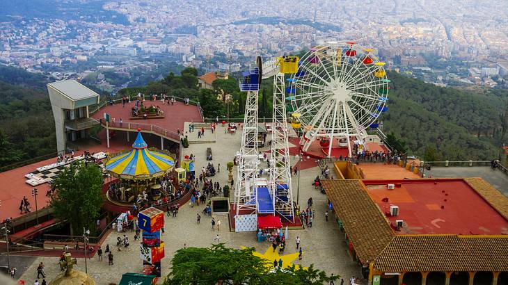 Aerial view of an amusement park with colourful rides, like a carousel