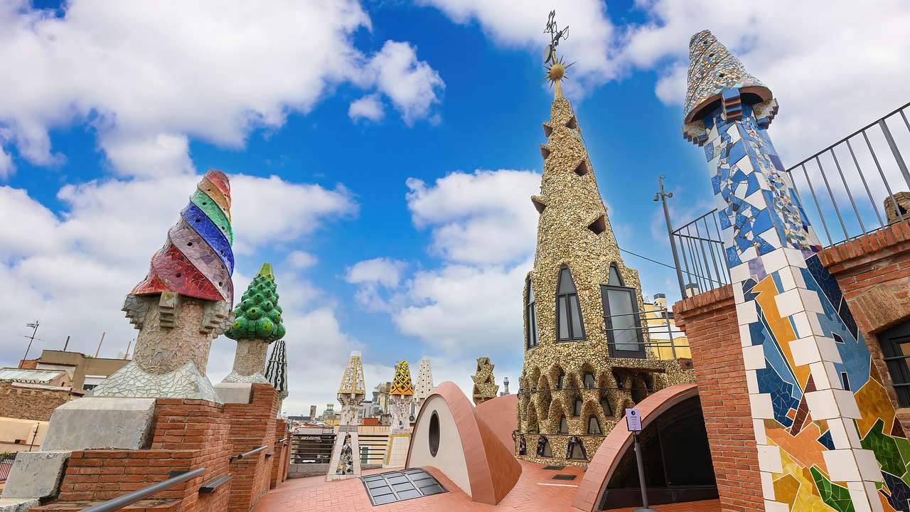 Chimneys decorated with mosaics using colourful broken ceramic tiles