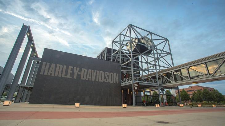 A wall that says "Harley-Davidson" with structures around it