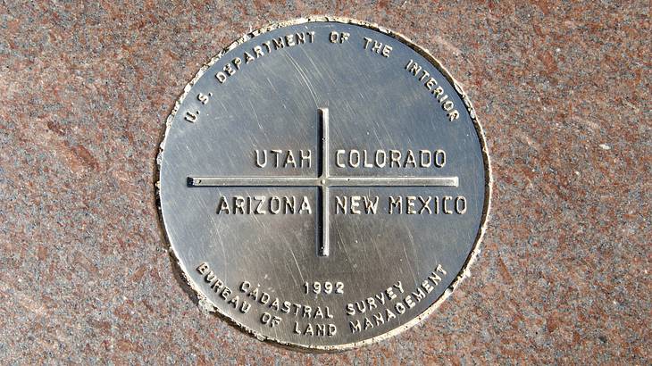 A bronze disk embedded in a granite floor A bronze disk embedded in a granite floor