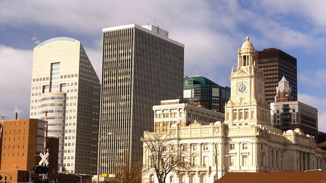 A skyline with a historical building against tall glass buildings