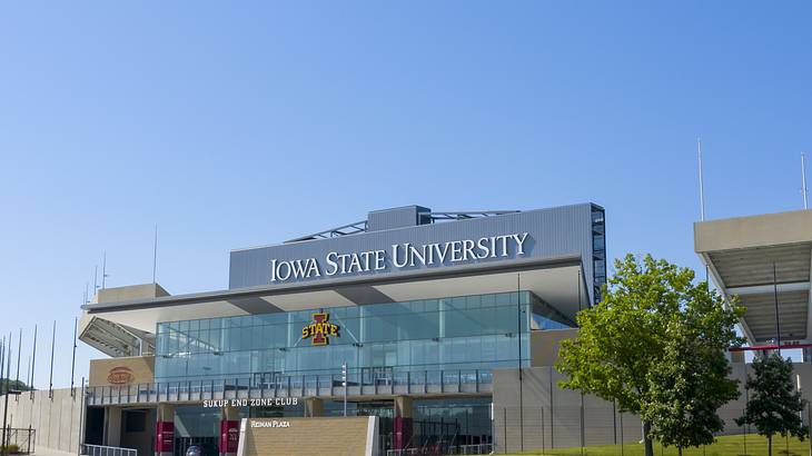 Text of "Iowa State University" on a wall of a stadium entrance