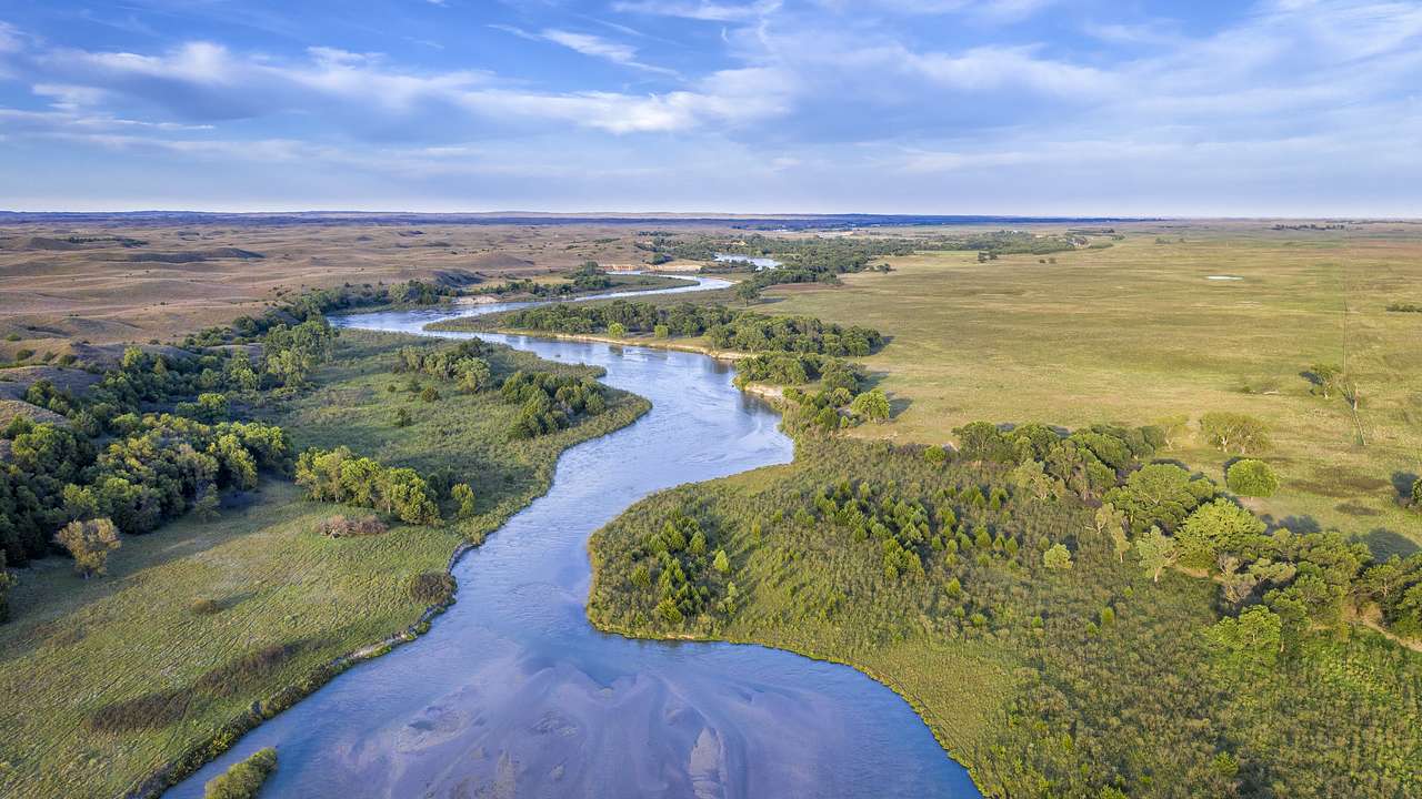 View from the top of a river winding through grasslands