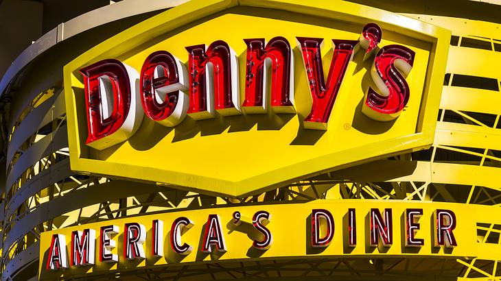 A big yellow and red sign with text that reads "Denny's America's Diner"