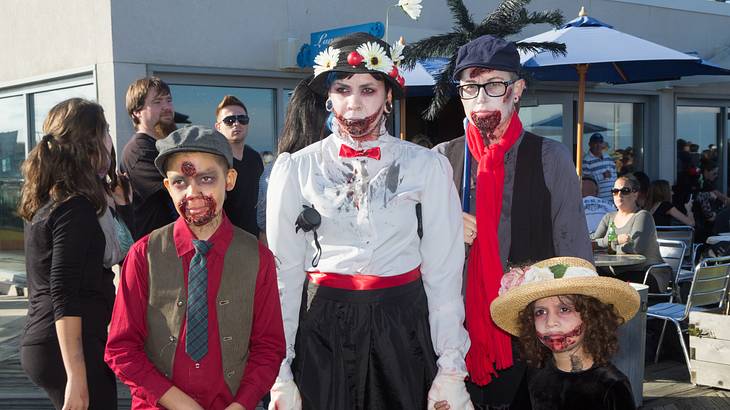 Kids and adults dressed as zombies
