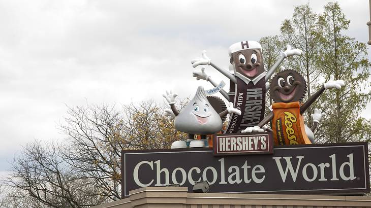 Mascots on Hershey's Chocolate World sign - one of the facts about Pennsylvania state
