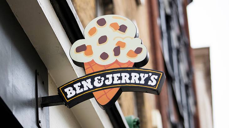 A building with an ice cream cone sign that says "Ben & Jerry's" A building with an ice cream cone sign that says "Ben & Jerry's"
