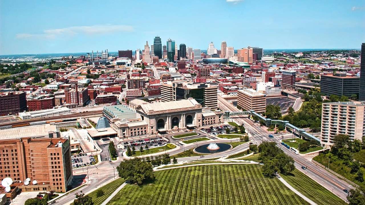An aerial view of Kansas City with a stone building with columns and skyscrapers
