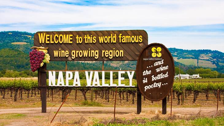 A sign next to a vineyard that says "Napa Valley"