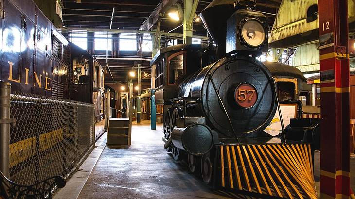 An old-fashioned train in an industrial-style museum