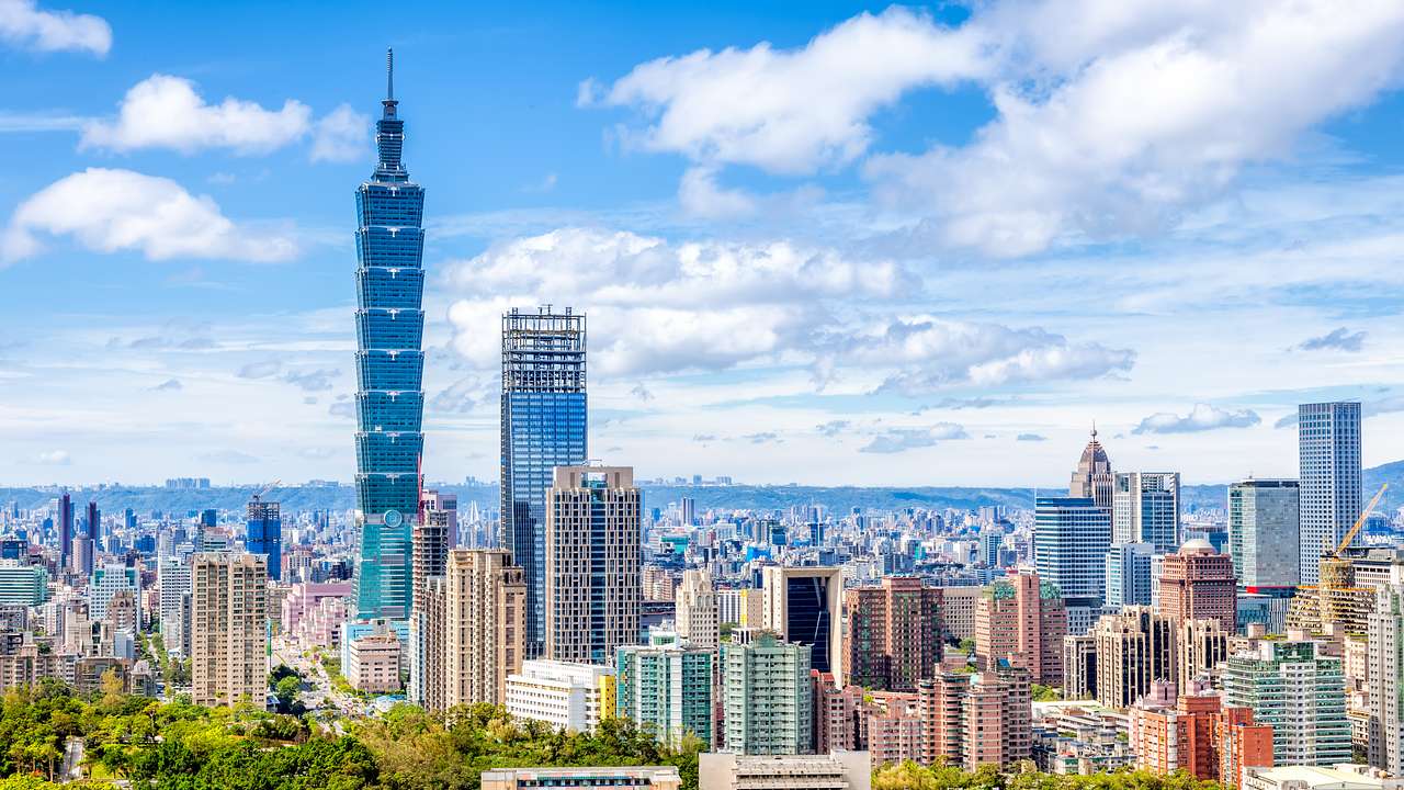 The Taipei skyline with tall buildings and the Taipei 101 tower on a nice day