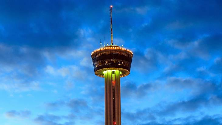 An observation tower illuminated at night