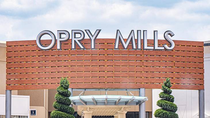 The exterior of a shopping mall that says "Opry Mills"