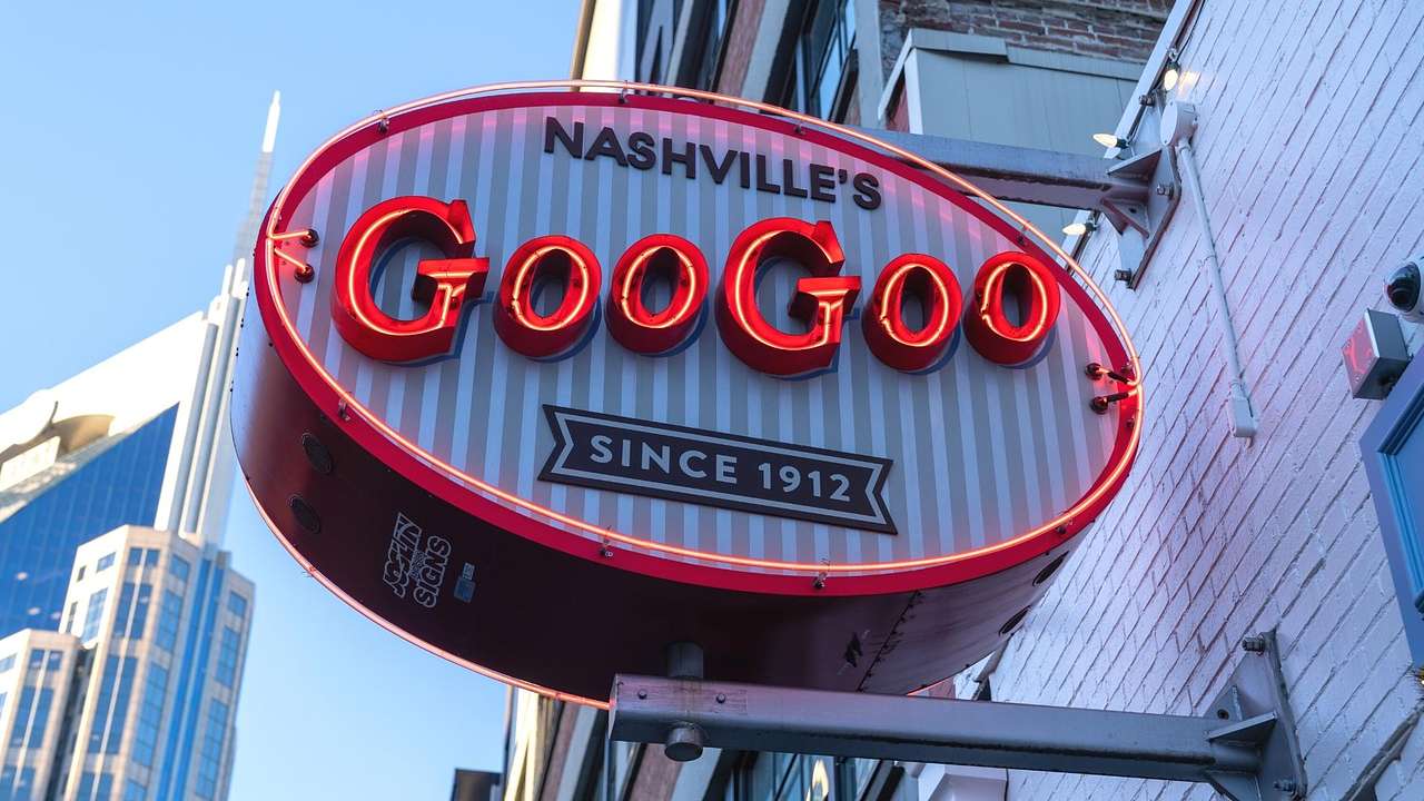 A neon sign on a building that says "Nashville's, Goo Goo, since 1912"